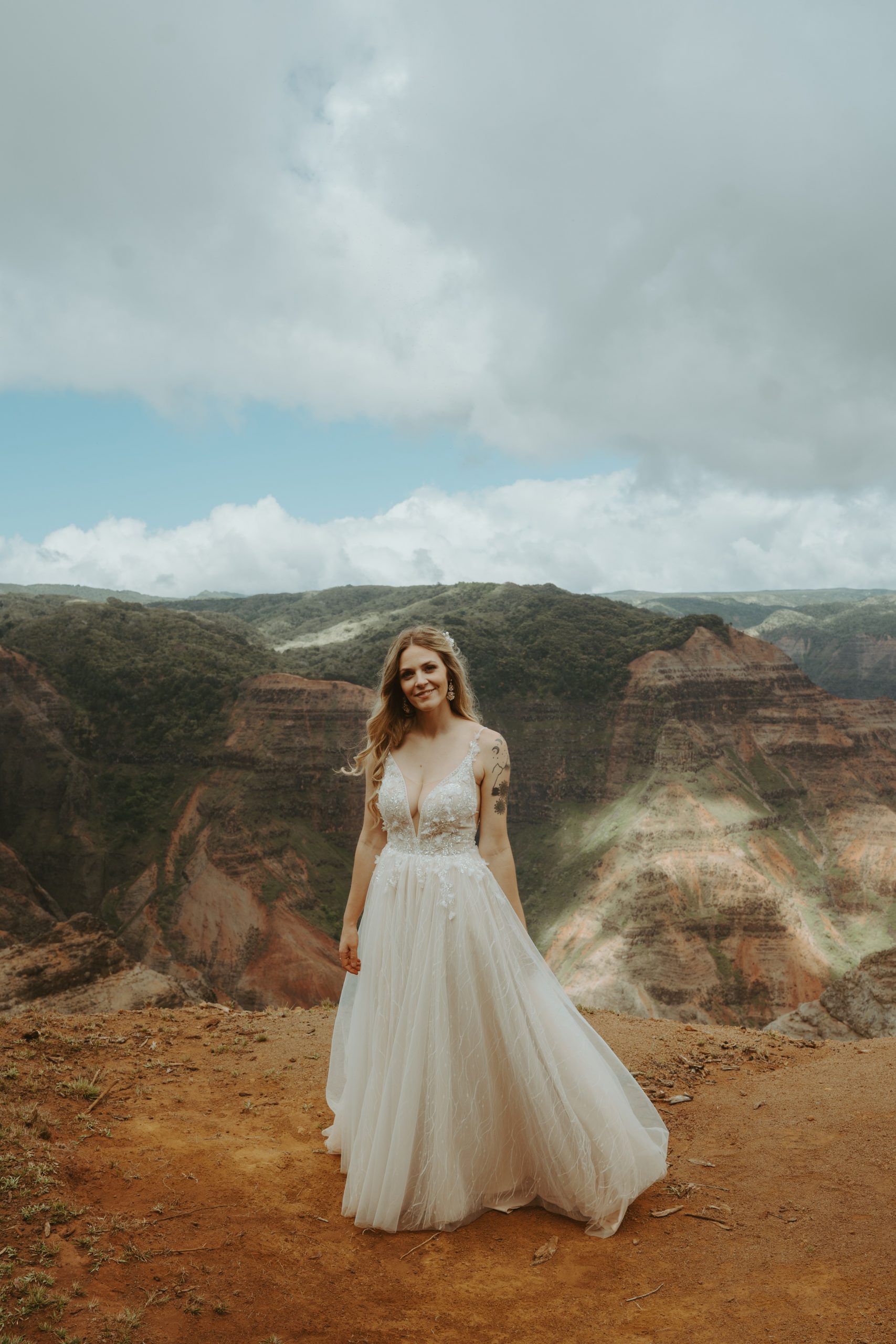 Bride poses during intimate Kauai elopement.