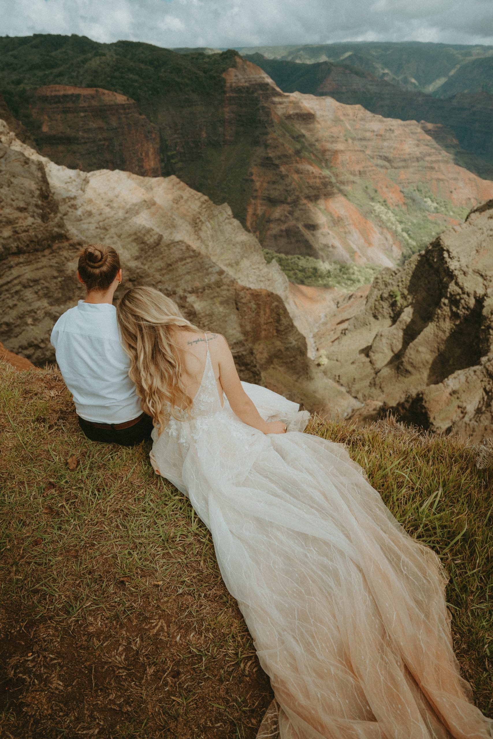 Bride and bride poses during intimate Kauai elopement.