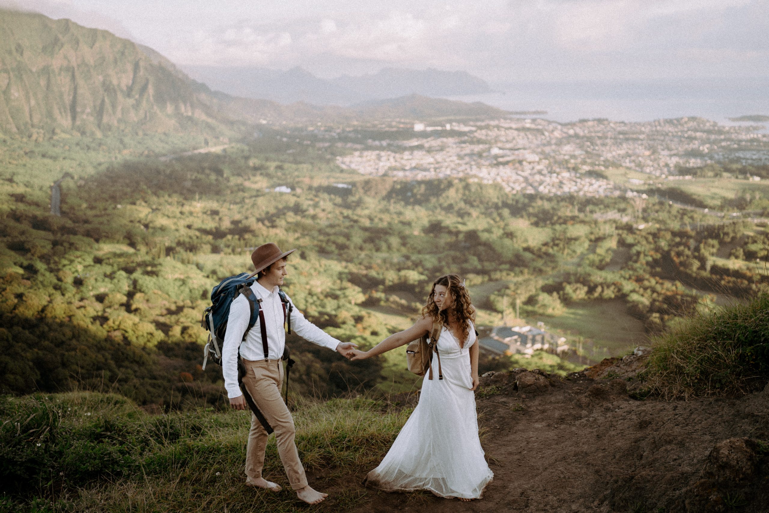 Newlyweds at their adventure elopement in Oahu captured by Masha Sakhno Photo.
