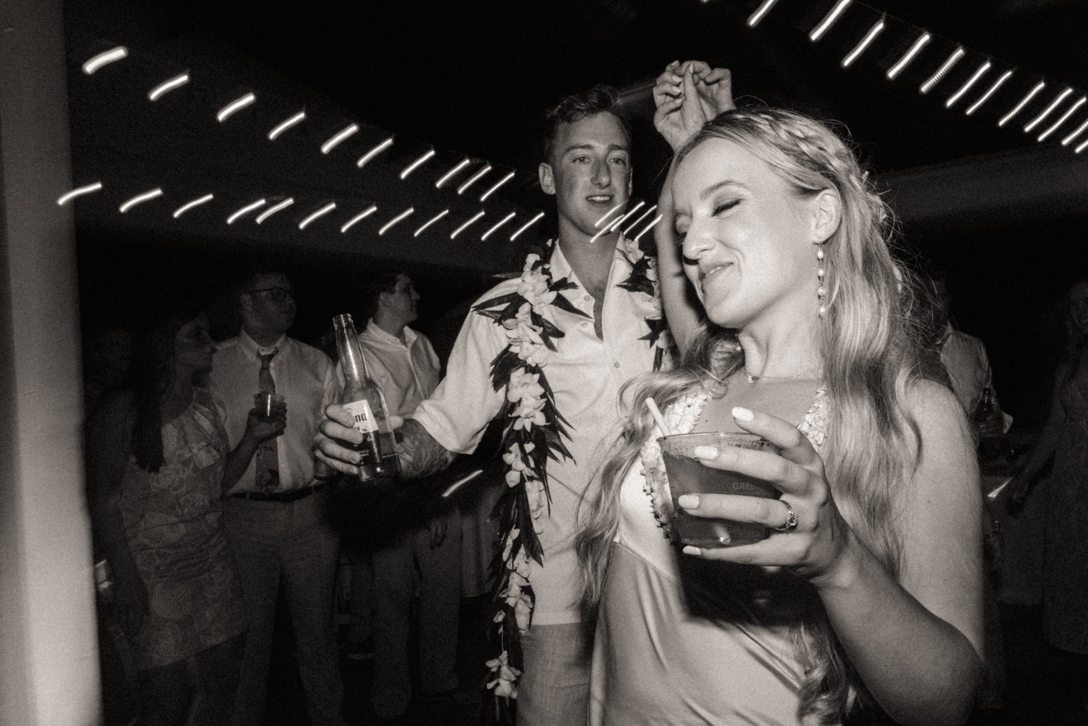Hawaii wedding videographer captures bride and groom dancing at reception.