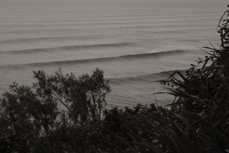 Black and white photo of waves crashing.
