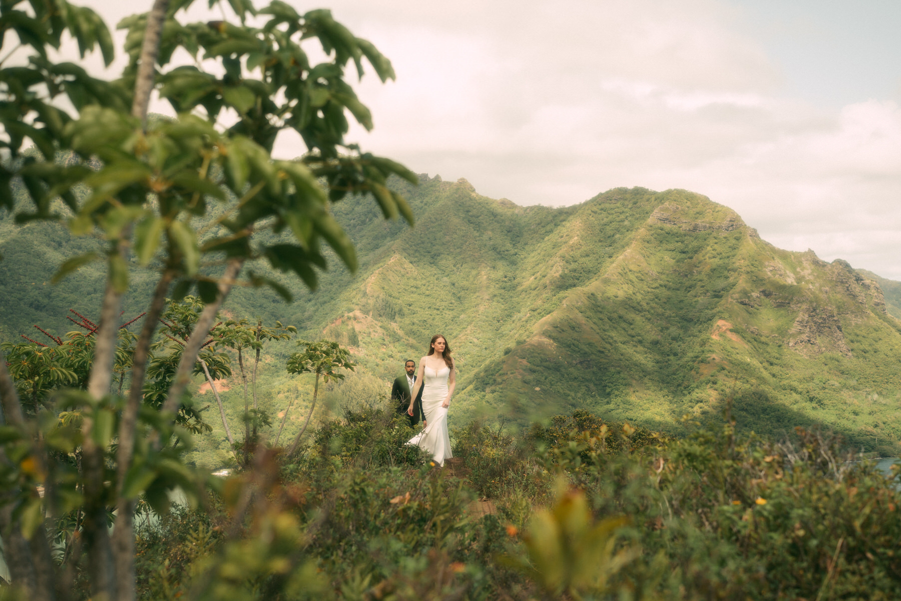 Bride and groom hike for their intimate Oahu elopement.