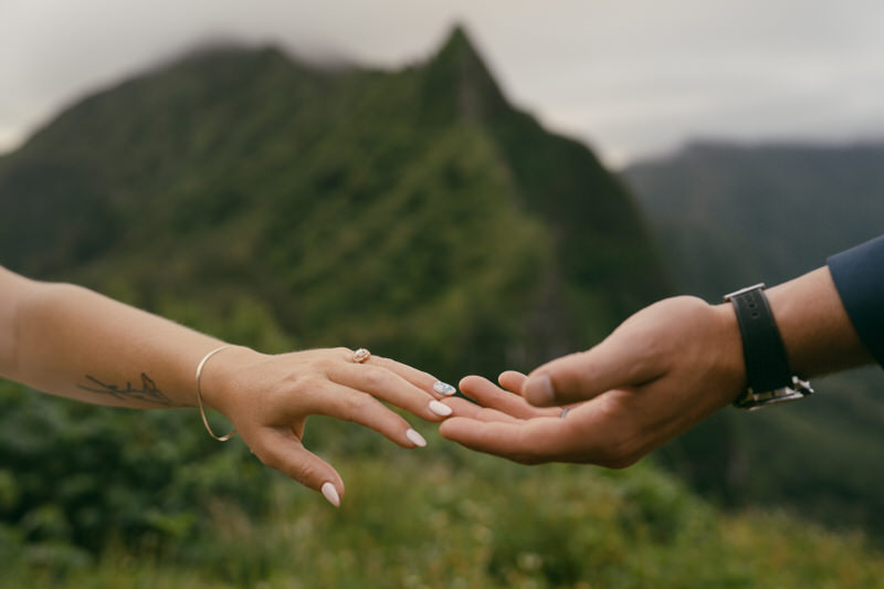 Bride and groom's hands on Pali Notches trail.