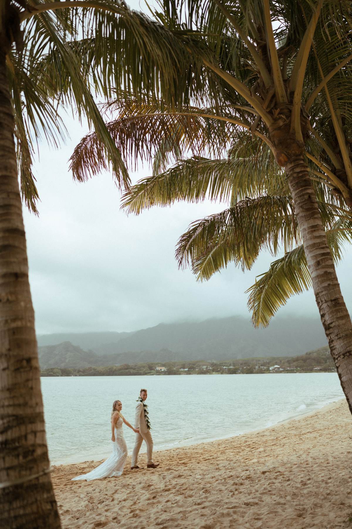 Newlyweds at secret island at Kualoa Ranch in Oahu.