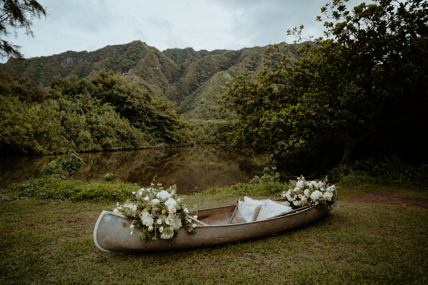 Wedding details featuring a floral filled canoe.