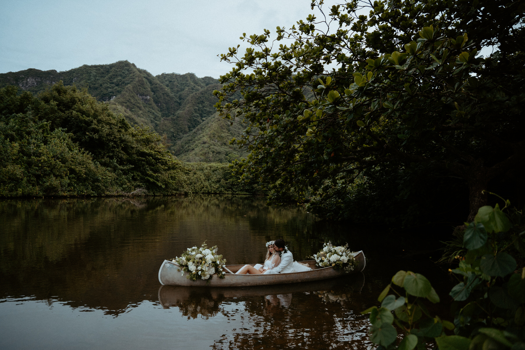 Wedding details featuring a floral filled canoe.