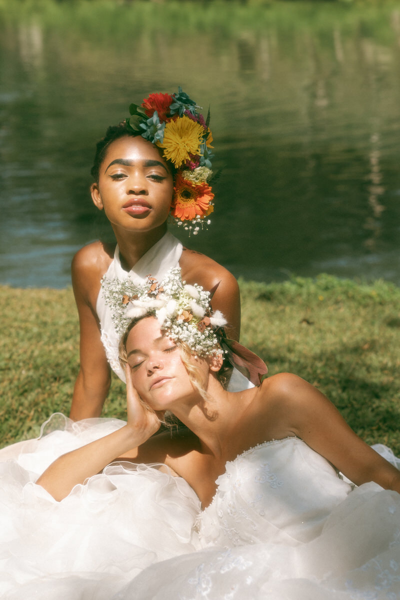 Two brides with couture floral headpieces.