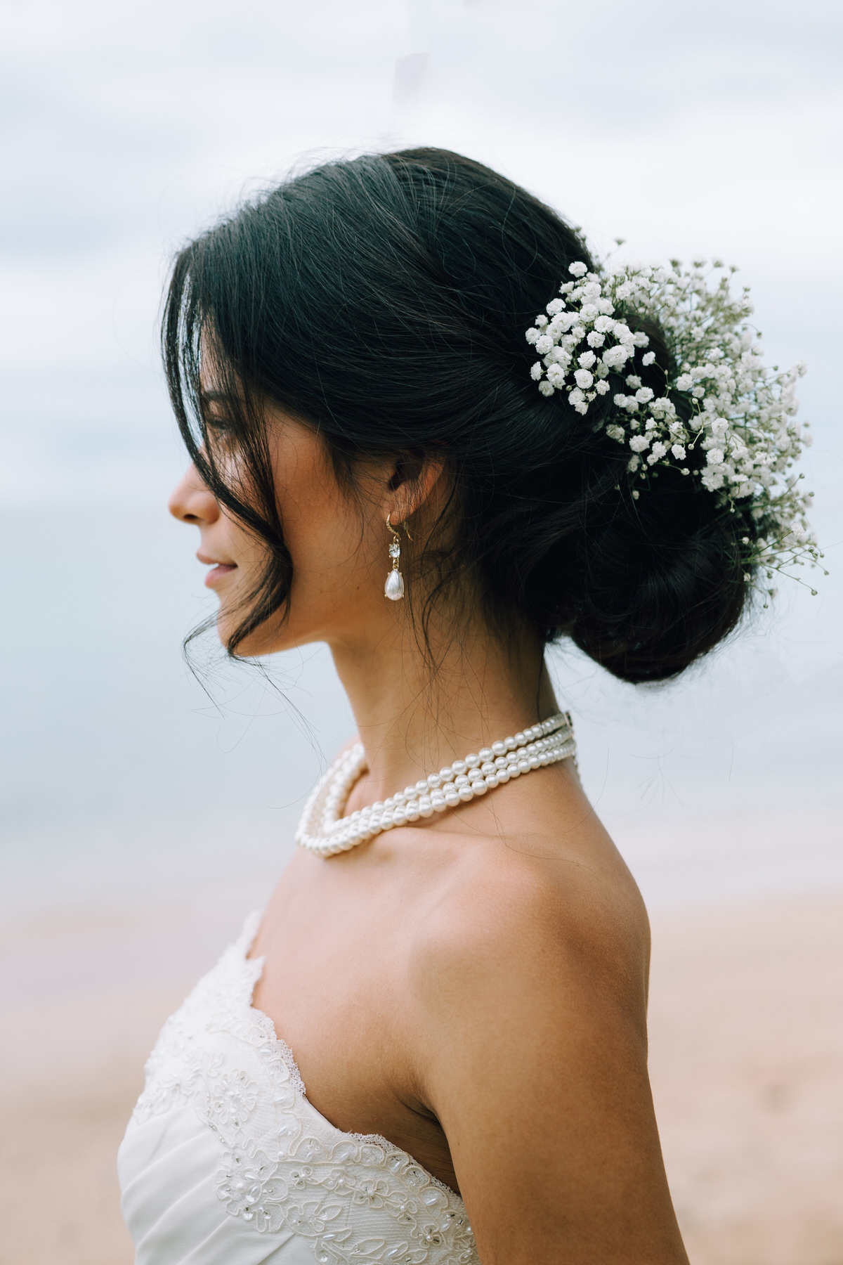 Bridal details with babies breath florals and pearls.