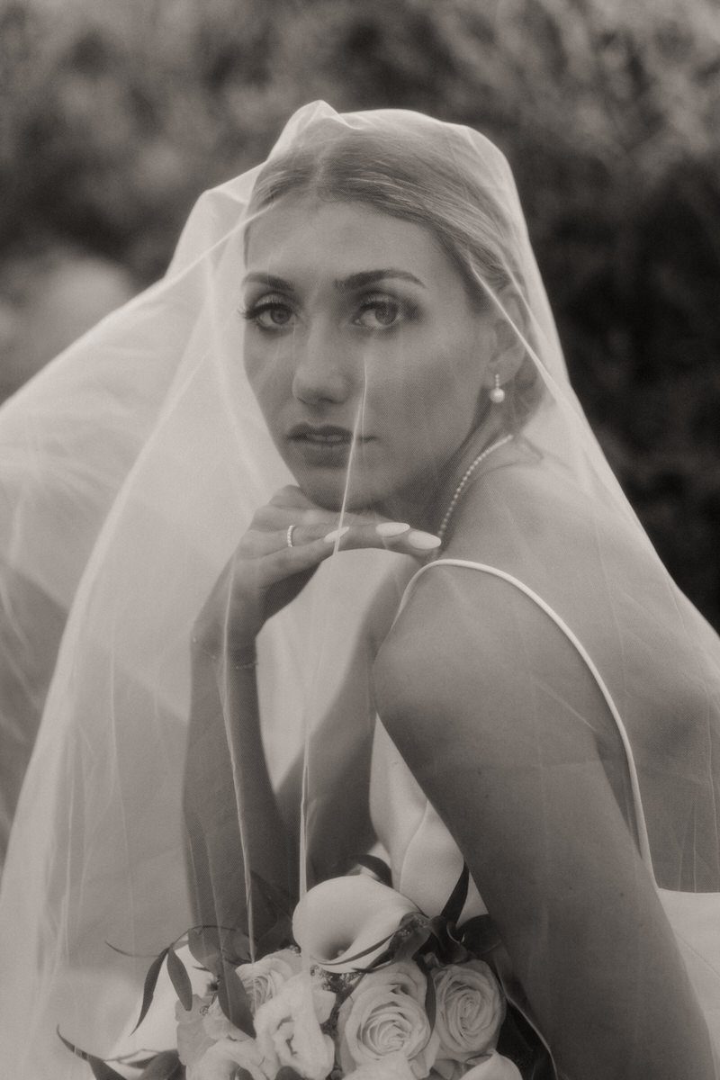 Bridal portrait of a woman under her veil, capturing the quiet elegance of the moment in Elopement Photography in Hawaii.