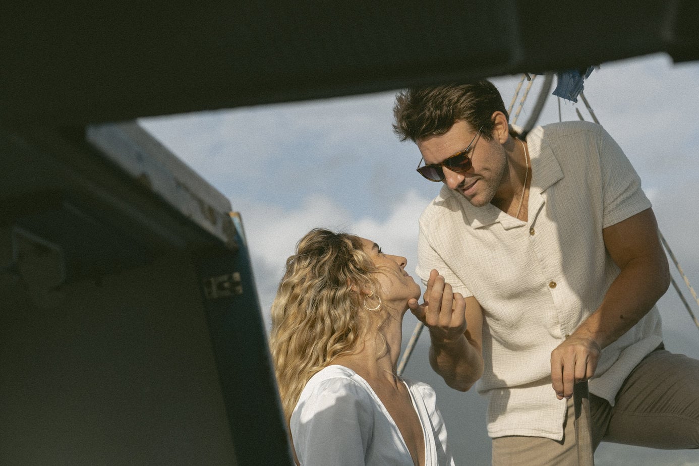 Couple playfully interacting during boat engagement session.