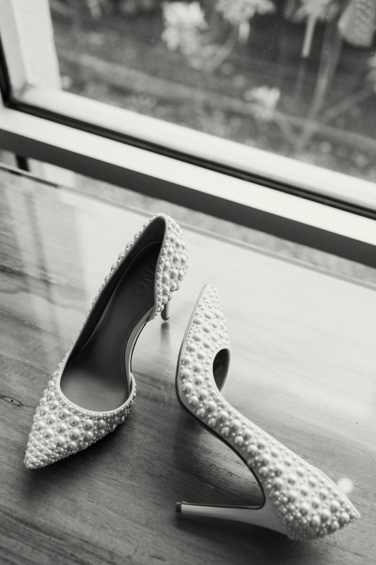 Pearled wedding shoes inside the Kahala Hotel and Resort. Oahu's best wedding venue..