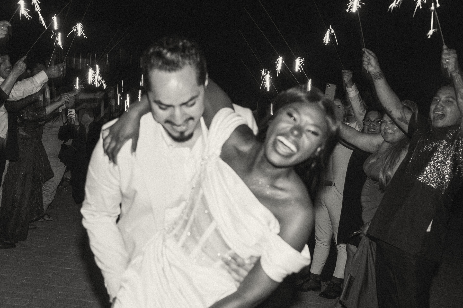 Couple after sparkler exit at Serendipity Gardens wedding.