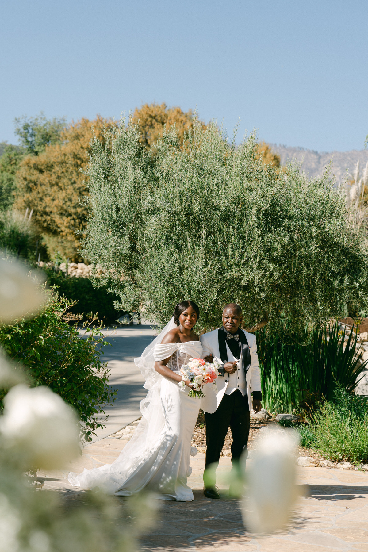 Father walking bride down aisle at Serendipity Gardens wedding.