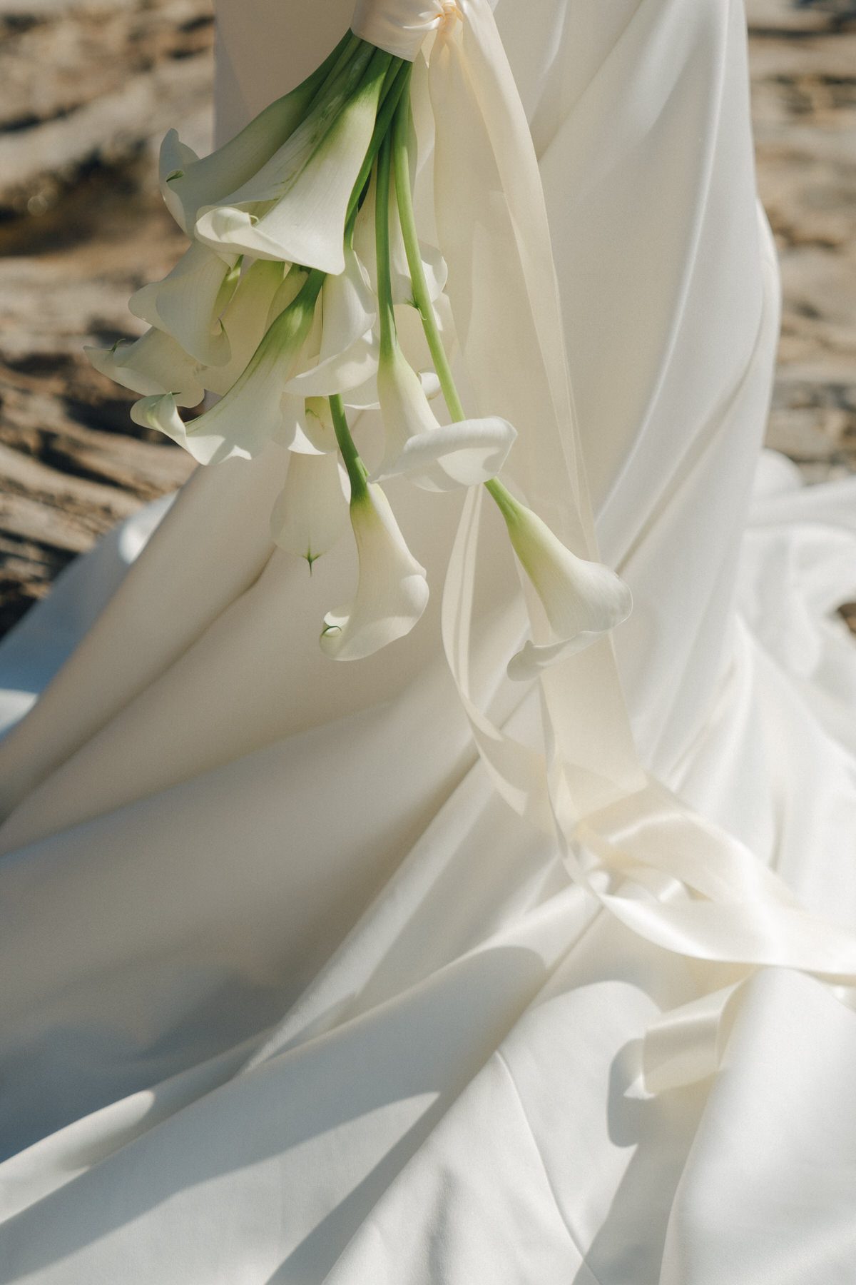 Bride and groom posing on Oahu’s sandy shores