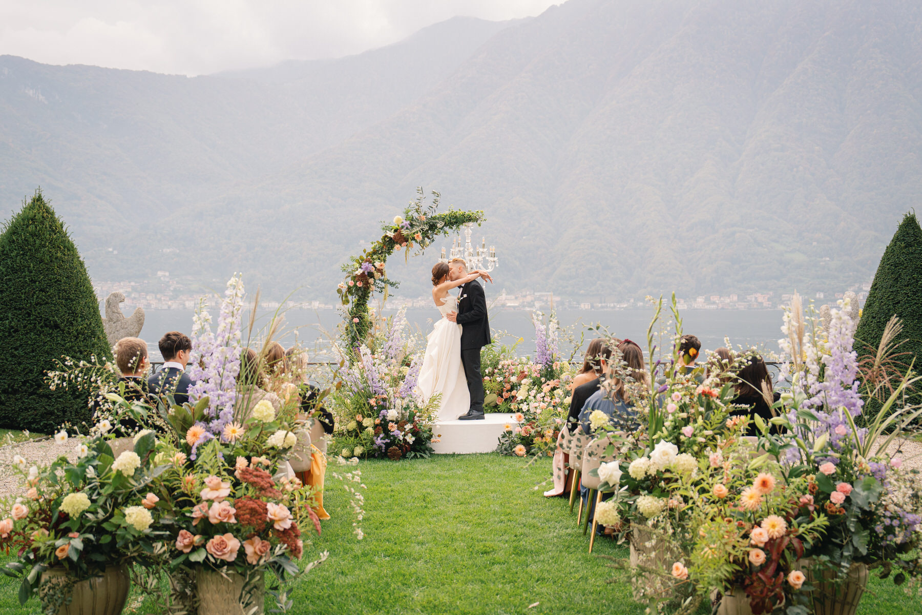 The first kiss at a wedding ceremony at Villa Balbiano in Lake Como Italy.