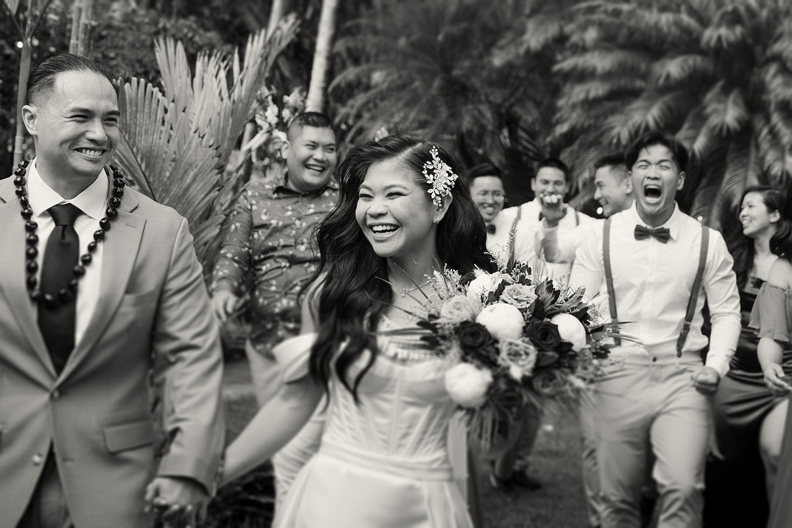 A joyful wedding party walking together with the bride, laughing and celebrating with their arms around each other.
