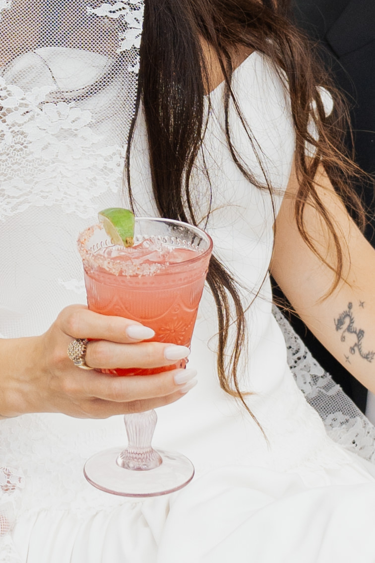 Bride enjoying cocktails at the Leahi room & Lanai by Deck in Honolulu.