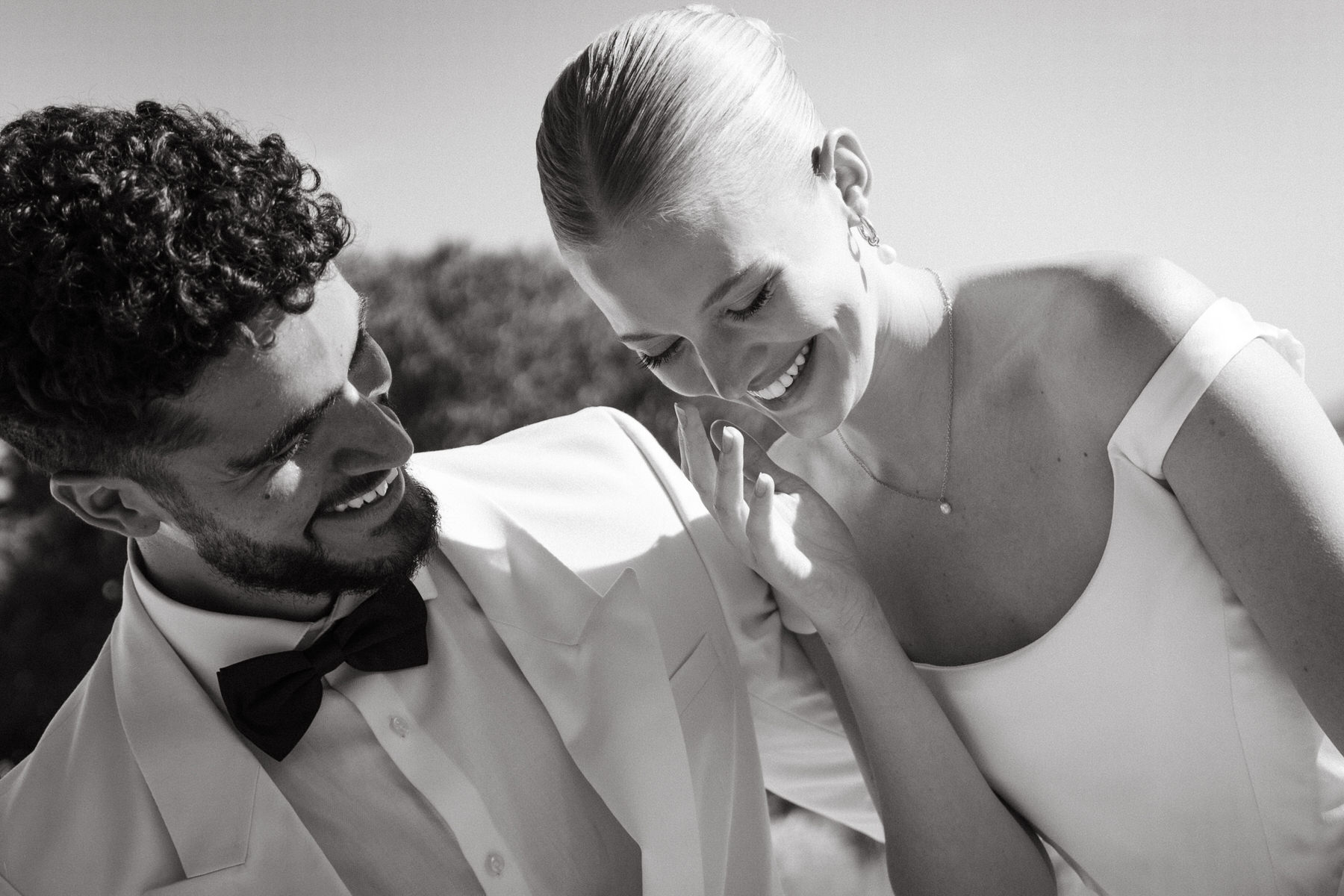 Black and white photo of bride and groom at wedding in Honolulu.