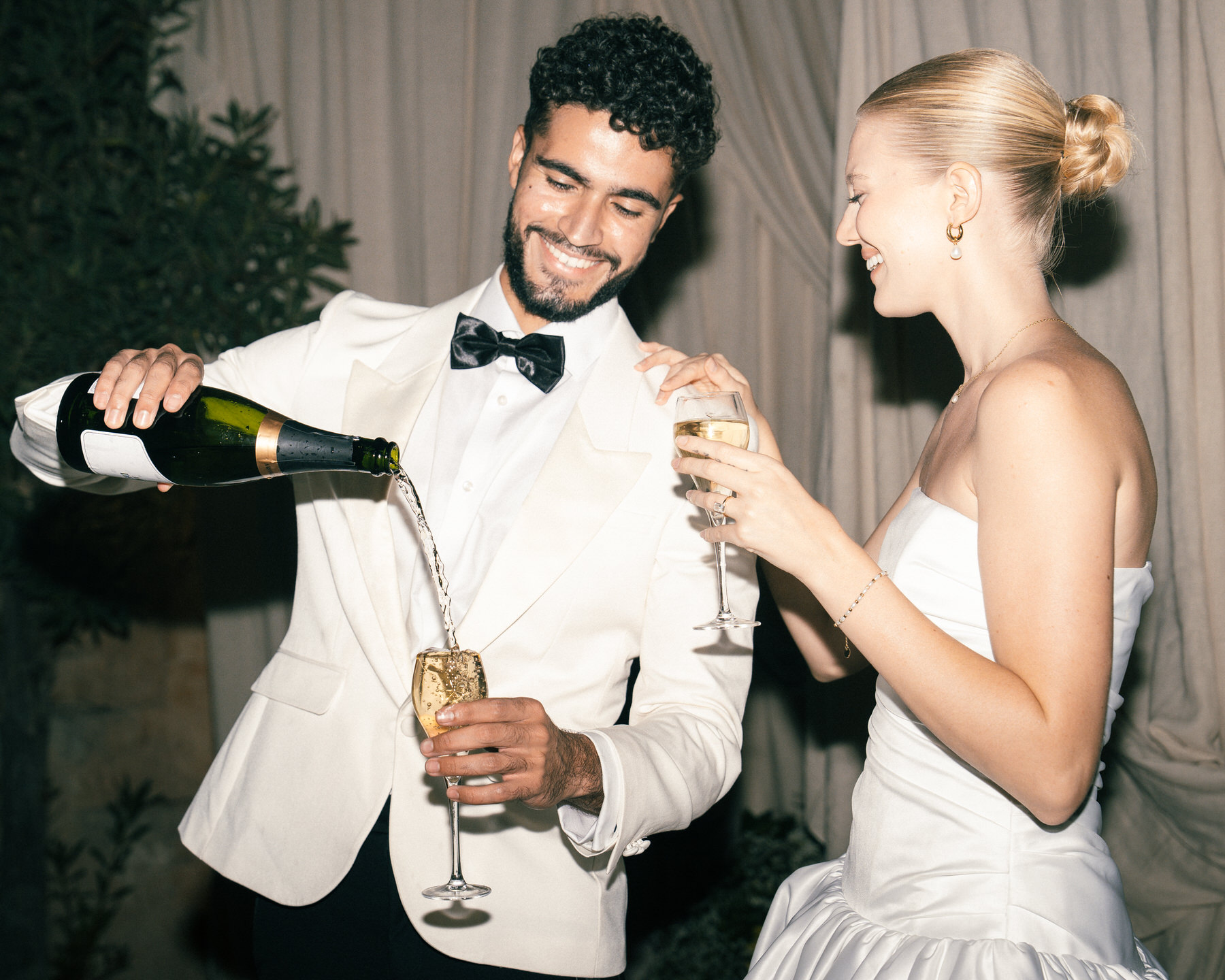 Bride and groom enjoying wedding reception at the Leahi room & Lanai by Deck in Honolulu.