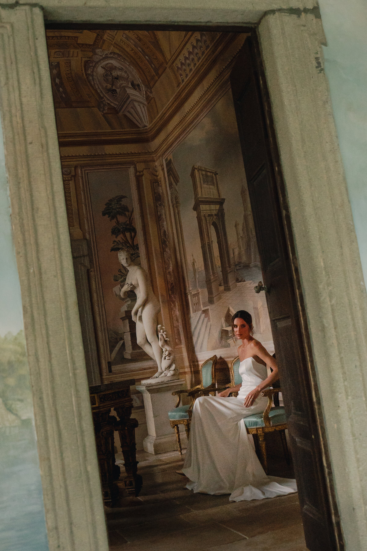 Bride looking serene and poised in a classic wedding gown inside a beautiful villa, captured in Bridal Photography in Hawaii."