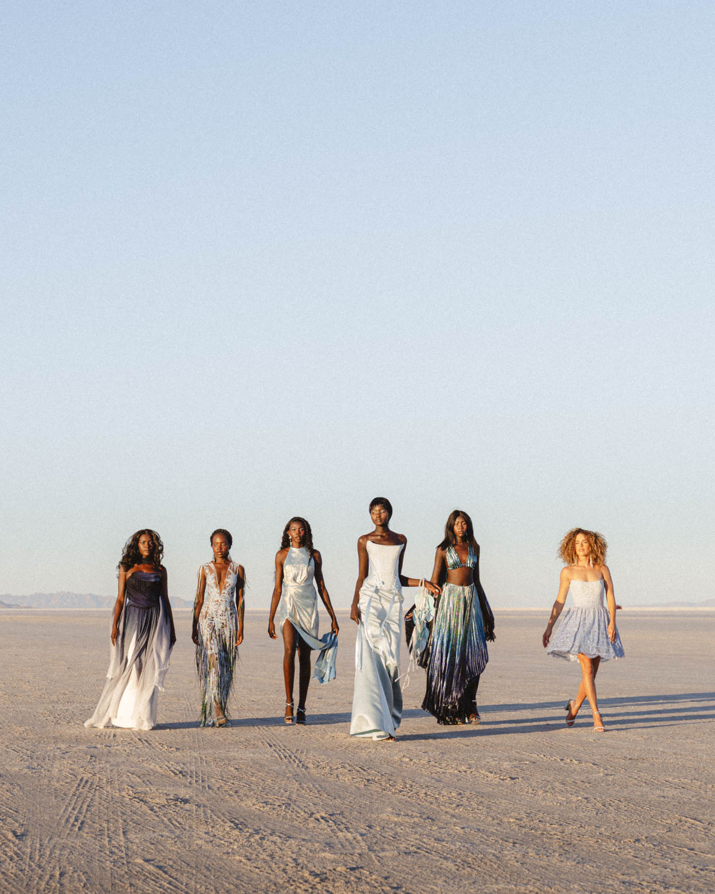 Bridal party walking during creative bridal session.