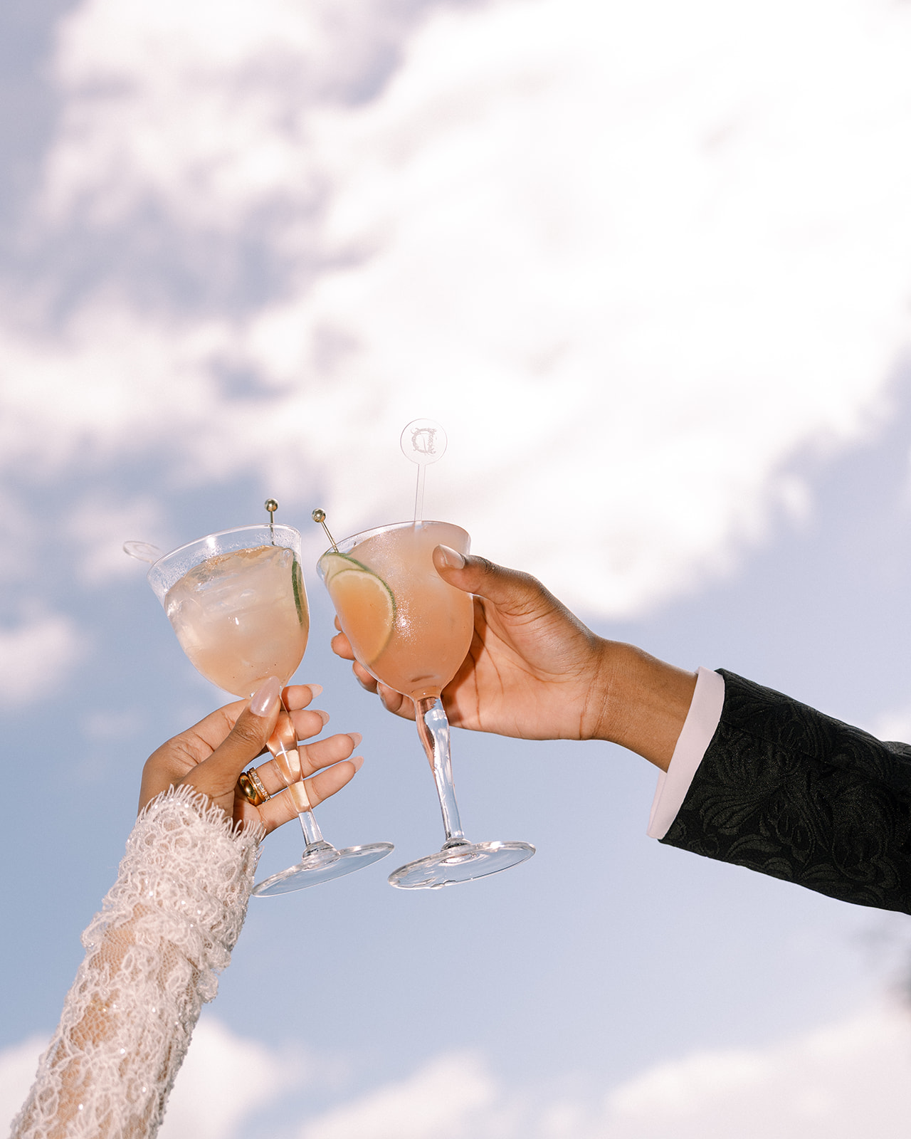 Cocktails in hand during a Brunch Wedding at Ochre Court Newport, as the bride and groom celebrate under the open sky.