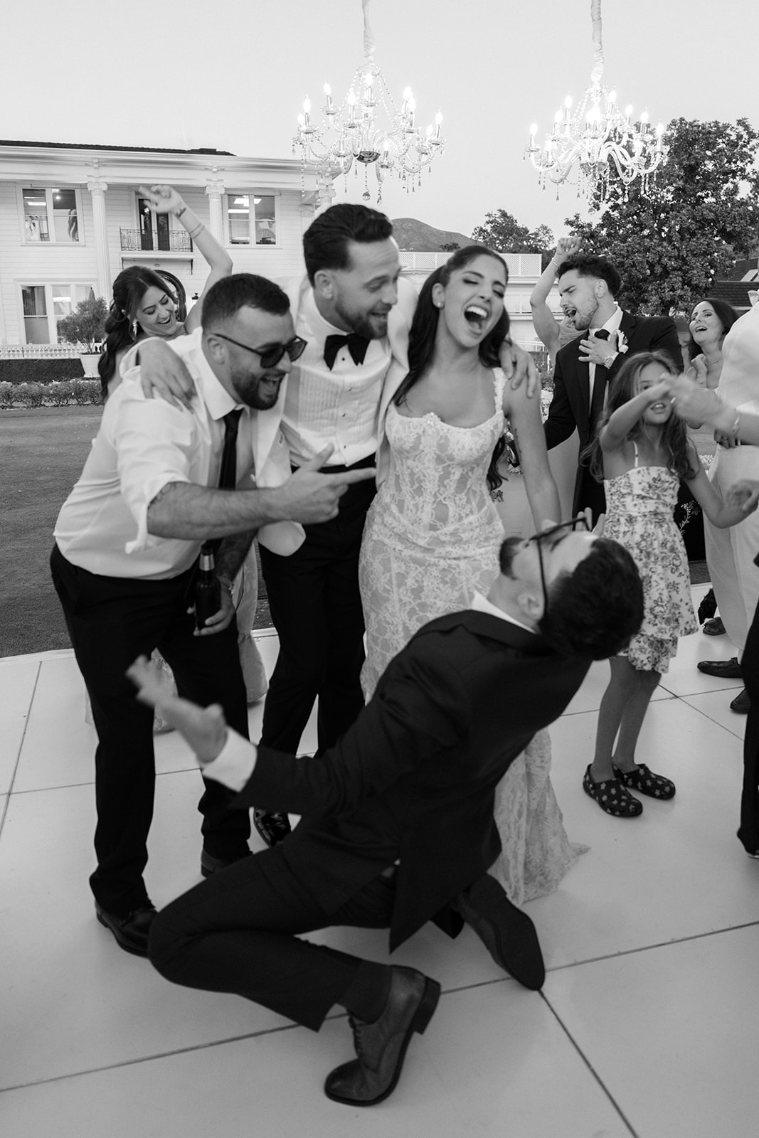 Bride and wedding guests dance during the outdoor reception at Silverado Resort in Napa.